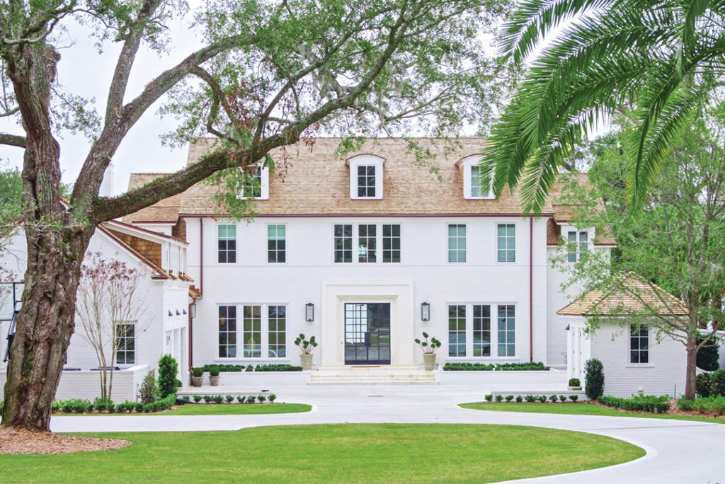 The Jacksonville home is classically proportioned in keeping with the historic neighborhood, with a steel and glass front door opening to a river view