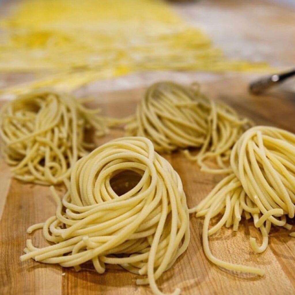 Noodles on a wooden cutting board.