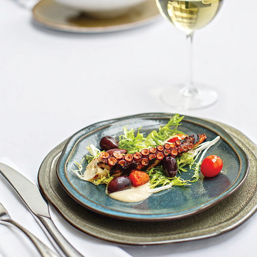 Grilled octopus with chickpea puree and salad: Photograph by Jessie Prezza
