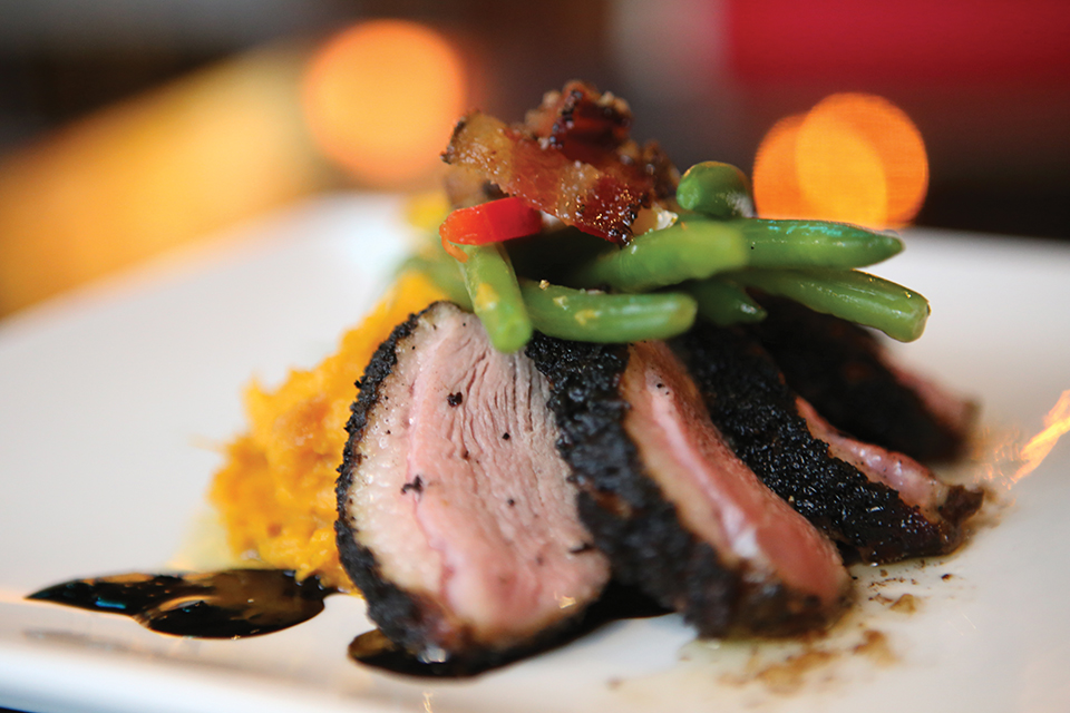 Seared duck breast at The Lure; Photograph by Val Ritter