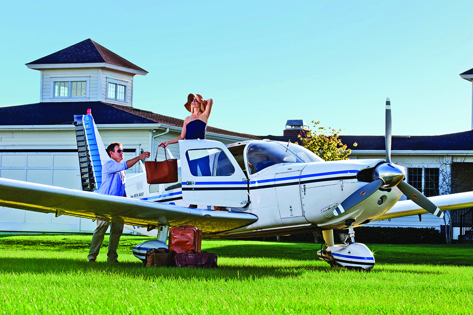 Christina and Jamie Clifford disembark a 1974 PA32 Piper Cherokee Six, at Grass Roots Airpark in Groveland. Photograph by Jeremiah Stanley