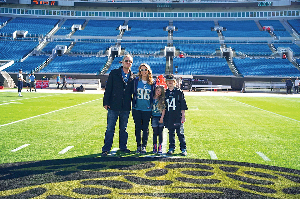 The singers pose with their children after a Jaguars game. Photography by Tedeschi Trucks Band