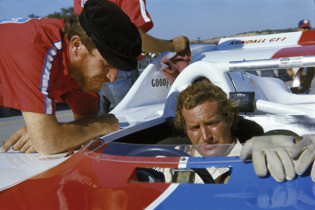 Haywood sits down in his car, the Porsche 917-10