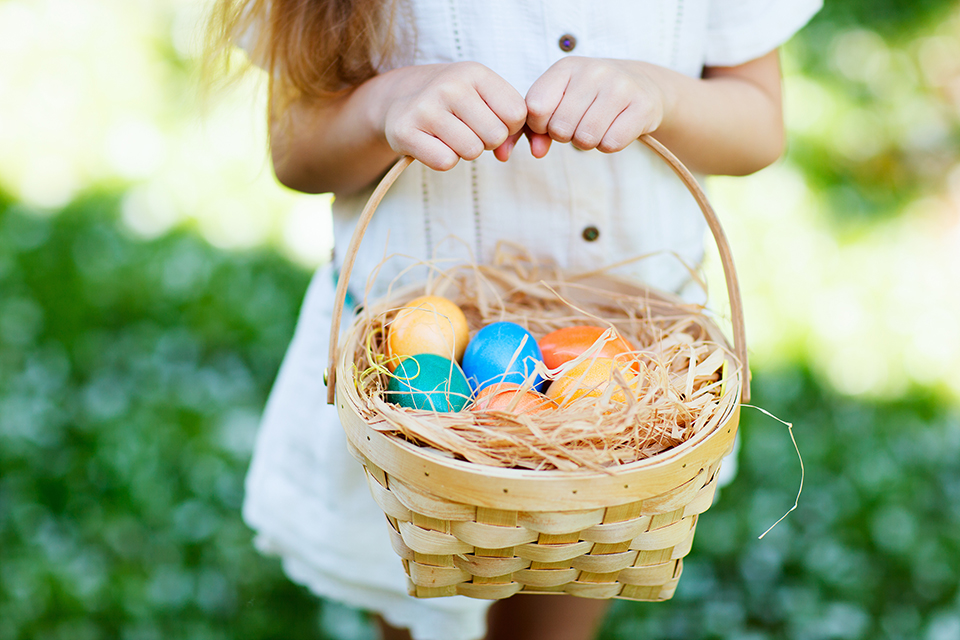 girl with easter basket of eggs